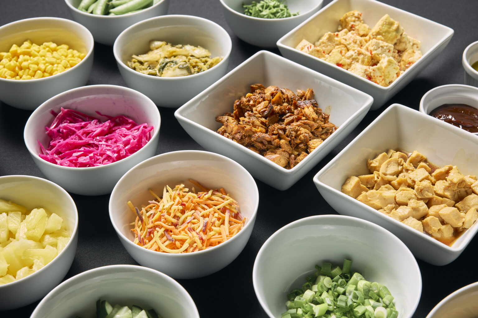 Catering spread of toppings and sides by Nameless Catering